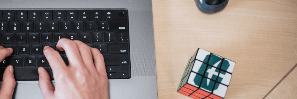 hands at a computer typing