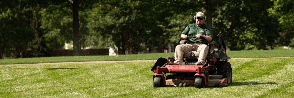 FM employee mowing