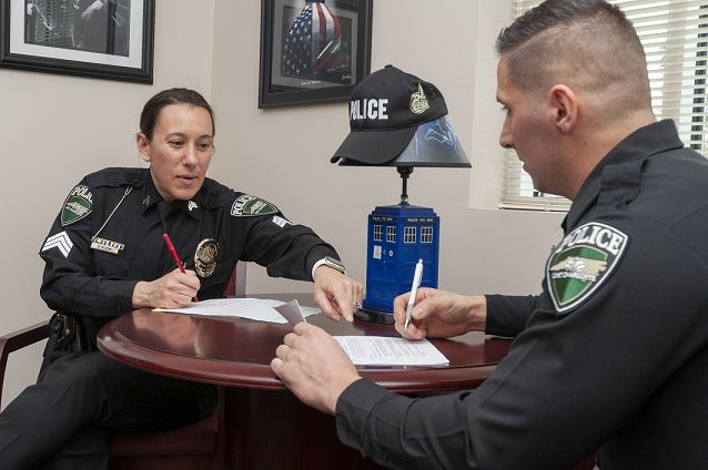 Sgt. Stephanie Klein reviews performance goals with Officer Chris Novello. Sgt. Stephanie Klein reviews performance goals with Officer Chris Novello.