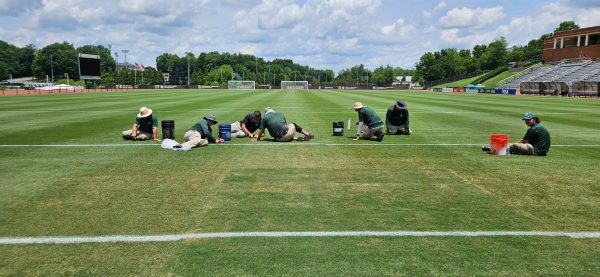Grounds crew working on soccer fields